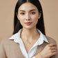 Mannequin wearing a white shirt with a gold necklace featuring a heart pendant.